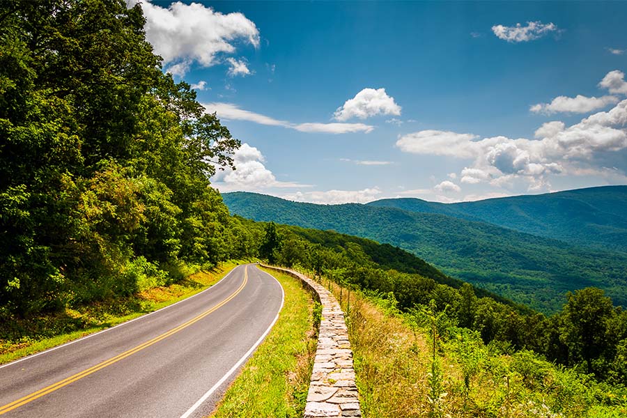 About Our Agency - View Of Skyline Drive And Blue Ridge Mountains On Sunny Day